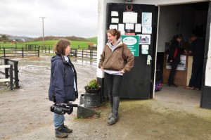 Roisin Kelly greets some customers at the stables at they prepare for their horseriding trek